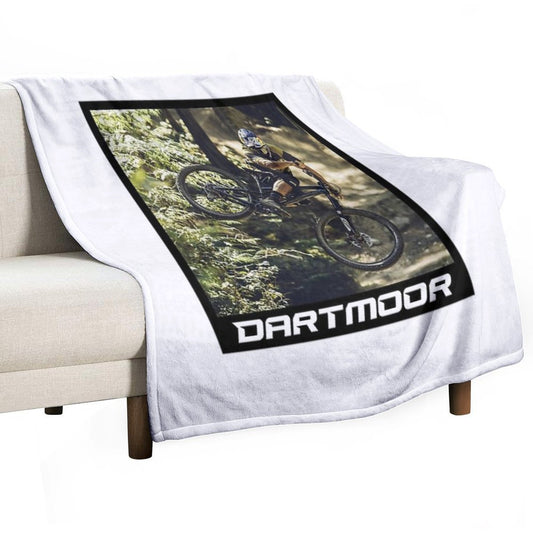 Cyclist Jumping with His Dartmoor Bikes Throw Blanket