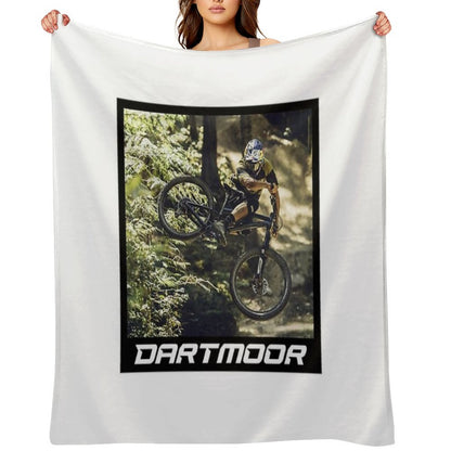 Cyclist Jumping with His Dartmoor Bikes Throw Blanket
