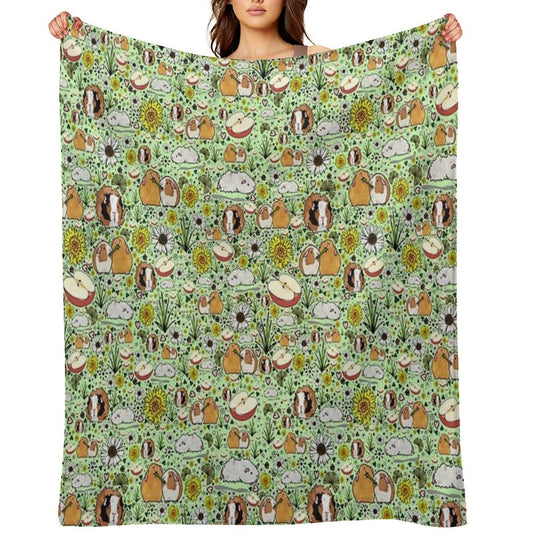 Guinea Pigs in Green Throw Blanket