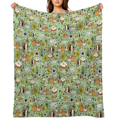 Guinea Pigs in Green Throw Blanket
