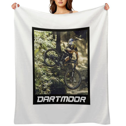 Cyclist Jumping with His Dartmoor Bikes Throw Blanket