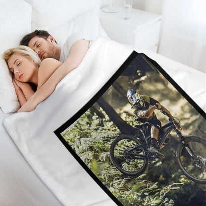 Cyclist Jumping with His Dartmoor Bikes Throw Blanket
