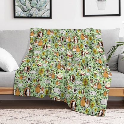 Guinea Pigs in Green Throw Blanket