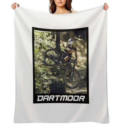 Cyclist Jumping with His Dartmoor Bikes Throw Blanket